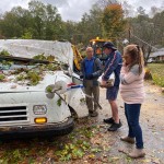 Mail Carriers Assessing The Damage After Tree Falls On Mail Truck In Statesville