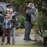 Neighbors console each other on Lord Granville Way in Rolesville