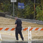 A Charlotte-Mecklenburg police officer blocks West Blvd