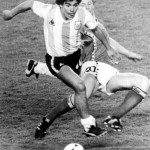 Argentina's Diego Maradona, Front, Is Attacked By Belgium's Guy Vandermissen During The Opening Game Of The Soccer World Cup In Barcelona, Spain