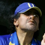 Diego Maradona Smokes A Cigar As He Watches Argentina's First Division Soccer Match Between Boca Juniors And River Plate In Buenos Aires, Argentina