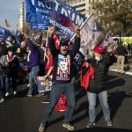 Supporters Of President Donald Trump Cheer As His Motorcade Drives Past A Rally Of Supporters Near The White House, Saturday, Nov. 14, 2020, In Washington