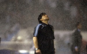 Under The Pouring Rain, Argentina's Coach Diego Maradona Looks Up Under The Pouring Rain During A 2010 World Cup Qualifying Soccer Match Against Peru, In Buenos Aires. Argentina Won 2 1