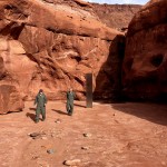Utah State Workers Walking Near A Metal Monolith In The Ground In A Remote Area Of Red Rock In Utah Ap 04