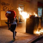 A Protester In An Elmo Mask Dances As A Street Fire Burns On May 30, 2020