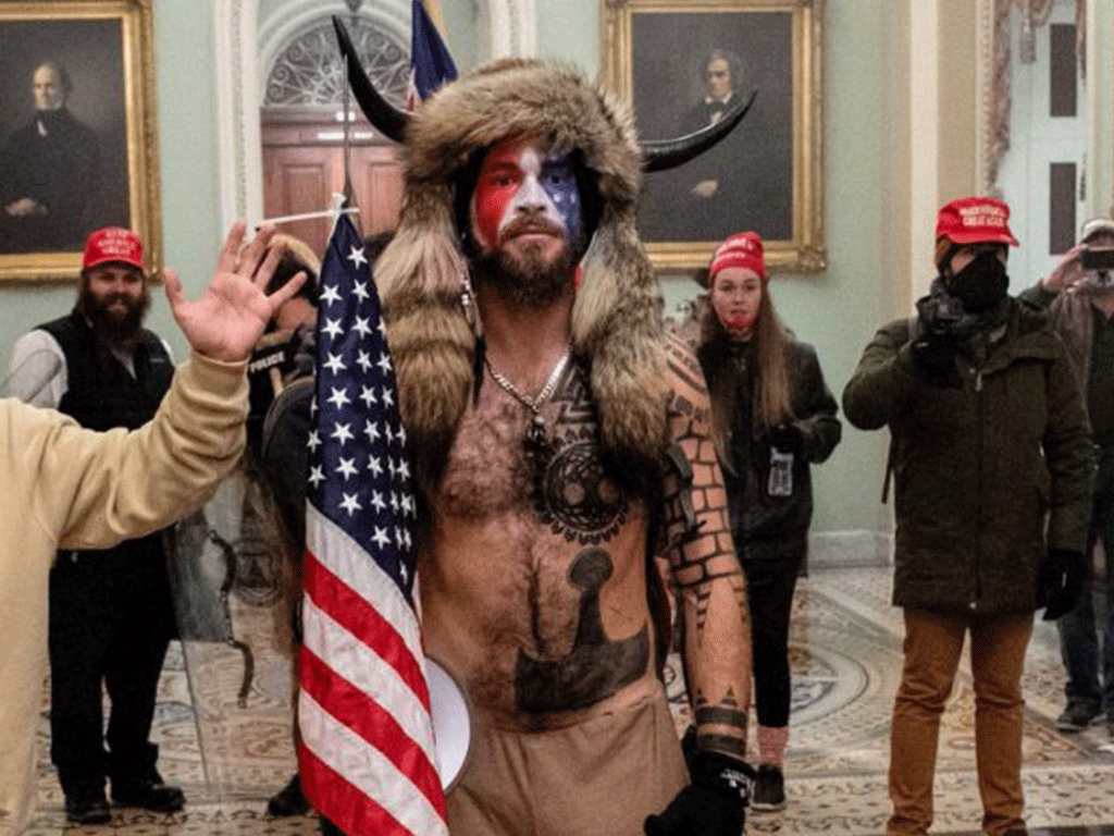 Jacob Chansley 33 Of Arizona Was Seen In The Capitol Wearing Face Paint No Shirt And A Furry Hat With Horns And Carrying A Us Flag Attached To A Spear