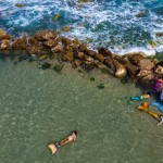 Members Of The Israeli Mermaid Community Swim With Mermaid Tails At The Beachfront In Bat Yam, Near Tel Aviv, Israel