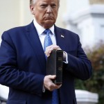 President Donald Trump Holds A Bible As He Stands Outside St. John's Church Across Lafayette Park From The White House In Washington On June 1, 2020