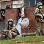 South African National Defense Forces Patrol The Men's Hostel In The Densely Populated Alexandra Township East Of Johannesburg On March 28