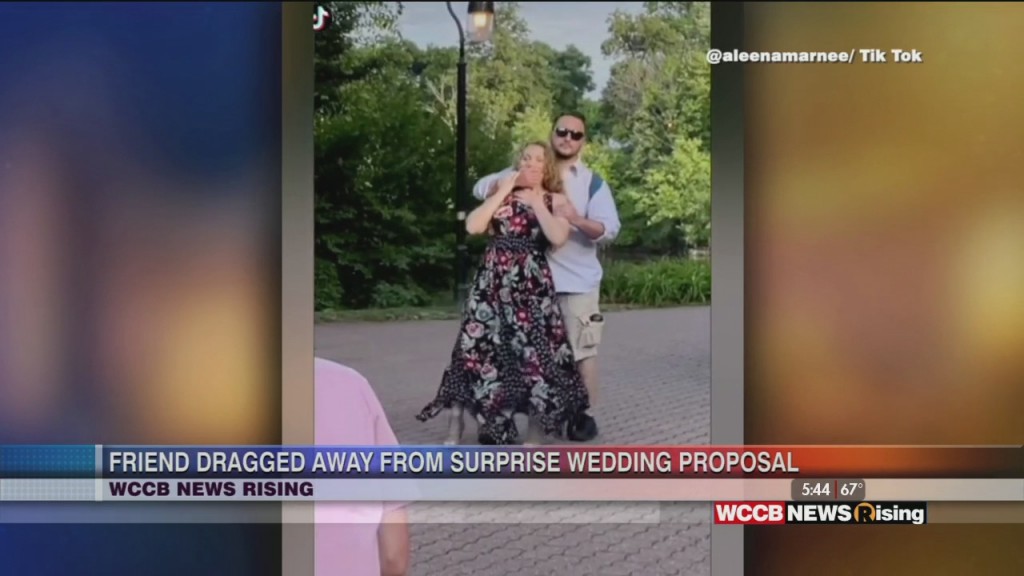 Woman Dragged Away From Surprise Proposal