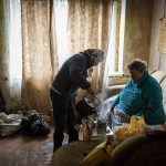 Lyubov Lomachuk 69 Serves Tea To Her Neighbour Valentyna Volynets 59 After Boiling Water For Her On A Makeshift Fire In A Public Garden Near Their Building In Bucha