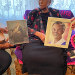 Corinne Holding Photos Of Mother And Sister Who Attended Barber Scotia