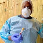 1 American Eagle Foundation Veterinarian Dr Mike Jones Holds A Blood Sample Taken From A Black Vulture For Analysis