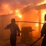 Firefighters battle the Eaton Fire as it engulfs structures Wednesday, Jan. 8, 2025 in Altadena, Calif. (AP Photo/Nic Coury)