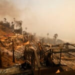 Homes damaged by the Palisades Fire are seen along the beach, Wednesday, Jan. 8, 2025, in Malibu, Calif. (AP Photo/Etienne Laurent)
