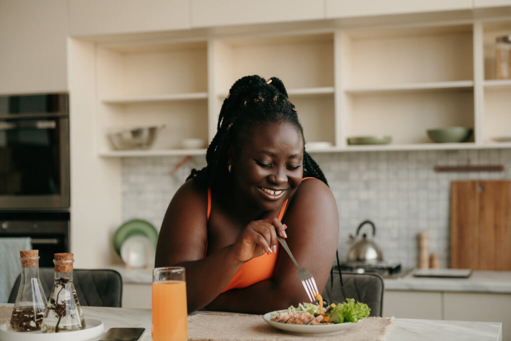 Beautiful Curvy African Woman Enjoying Healthy Eating For Lunch At Home