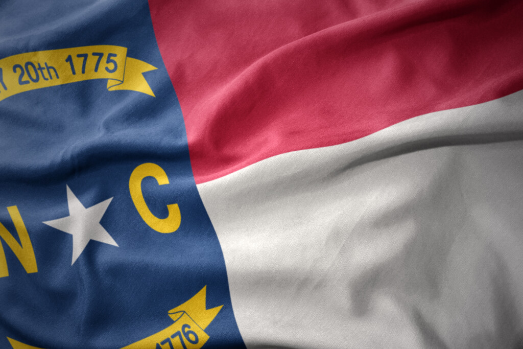 Waving Colorful Flag Of North Carolina State.