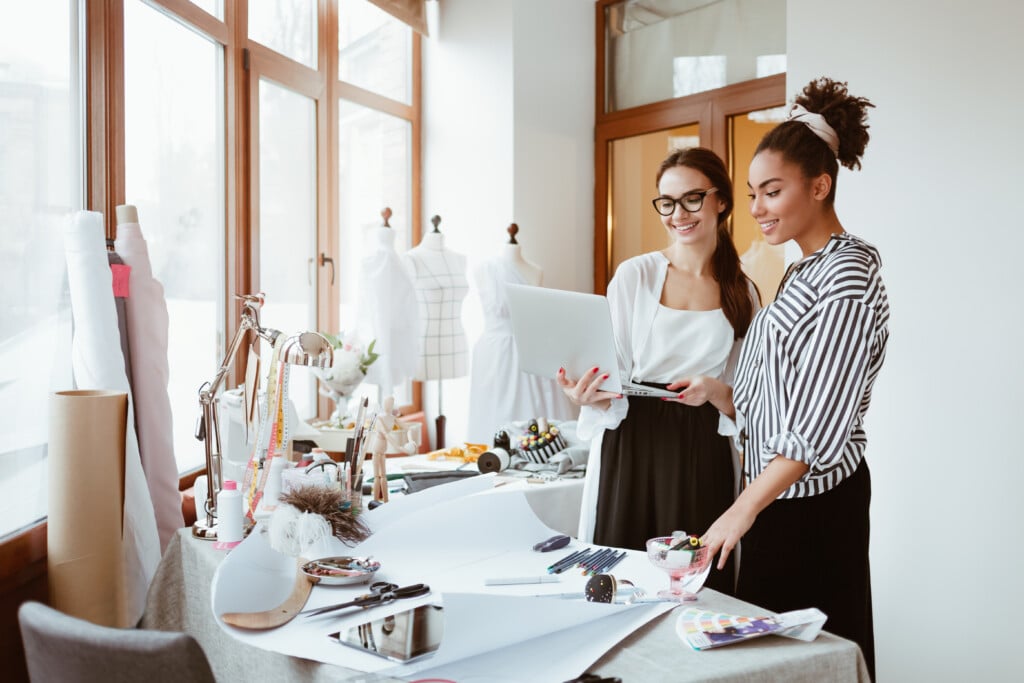Project Manager Consultates Young Designer. Two Women In Design Studio