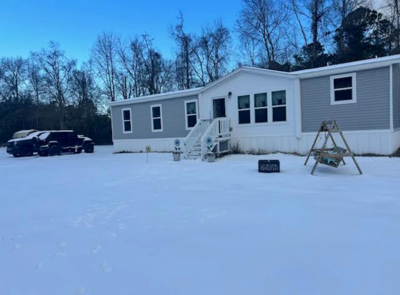 Rare snowfall blankets a home in Goose Creek, SC on Wednesday, January 22, 2025.