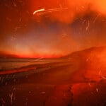 The Palisades Fire burns a beach front property Wednesday, Jan. 8, 2025 in Malibu, Calif. (AP Photo/Etienne Laurent)