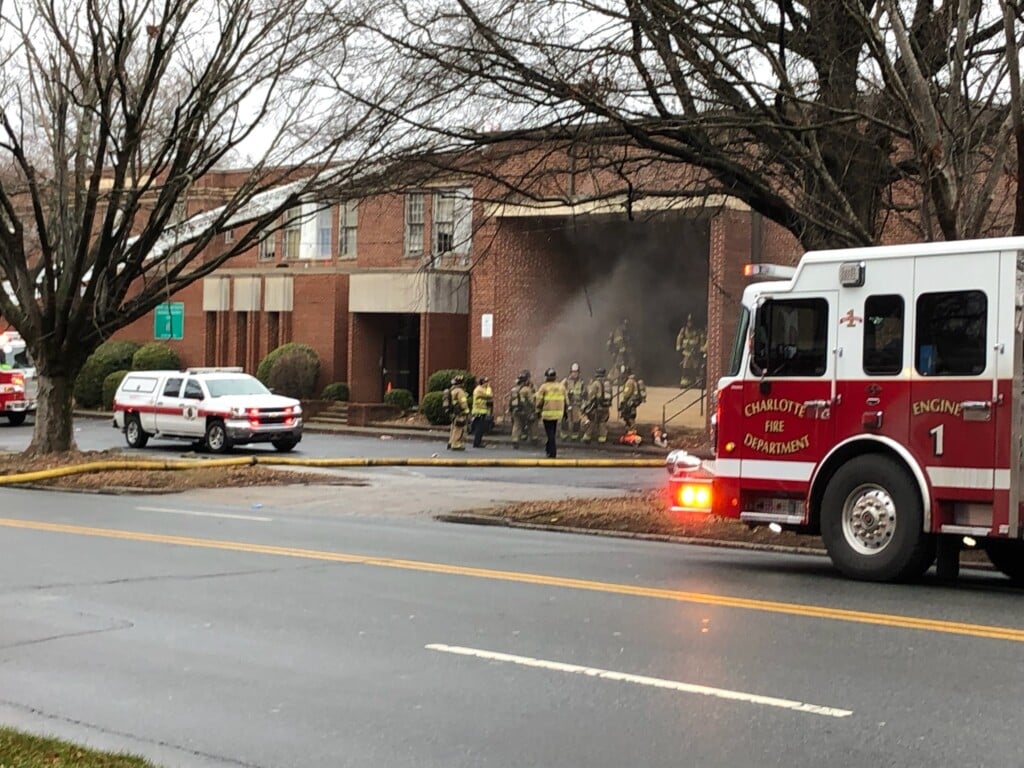 Firefighters work to put out a fire at the old Wilmore School on West Blvd. Monday 1/27/25.