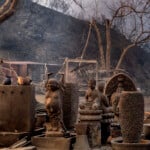 Charred Buddha statues stand amidst other sculptures at burned out shop in Malibu, Calif., Wednesday, Jan. 8, 2025. (AP Photo/Richard Vogel)