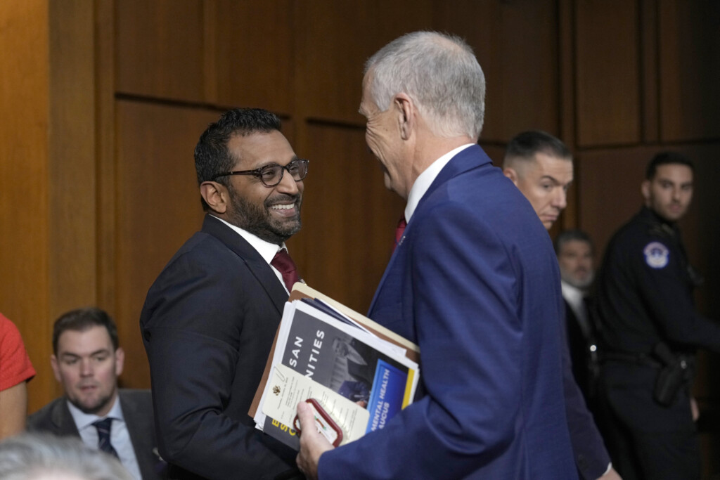 Kash Patel, President Donald Trump's choice to be director of the FBI, left, shakes the hand of Sen. Thom Tillis, R-N.C., as he departs following a confirmation hearing before the Senate Judiciary Committee at the Capitol in Washington, Thursday, Jan. 30, 2025. (AP Photo/Ben Curtis)