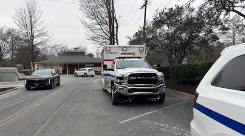 2 Medic employees were hurt when a vehicle hit an ambulance and took off Wednesday morning.