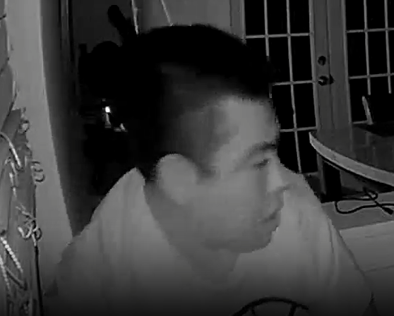 A picture from a surveillance camera shows a man wanted for a burglary at a home in Monroe.