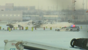 A Delta Air Lines plane lies upside down at Toronto Pearson Airport on Tuesday, Feb. 18, 2025. (CNN)