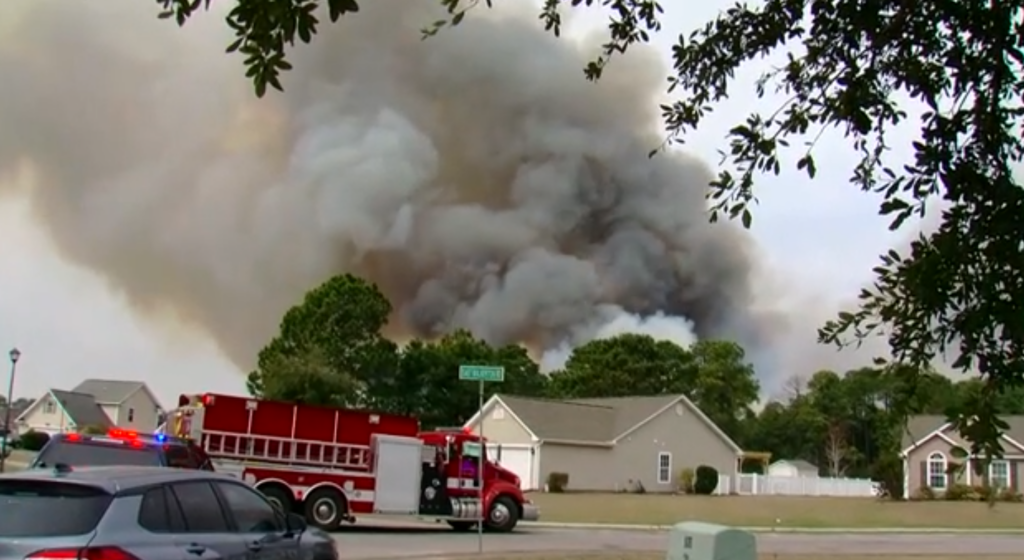 Smoke is seen from a wildfire burning in Myrtle Beach, SC on Sunday, March 2, 2025.
