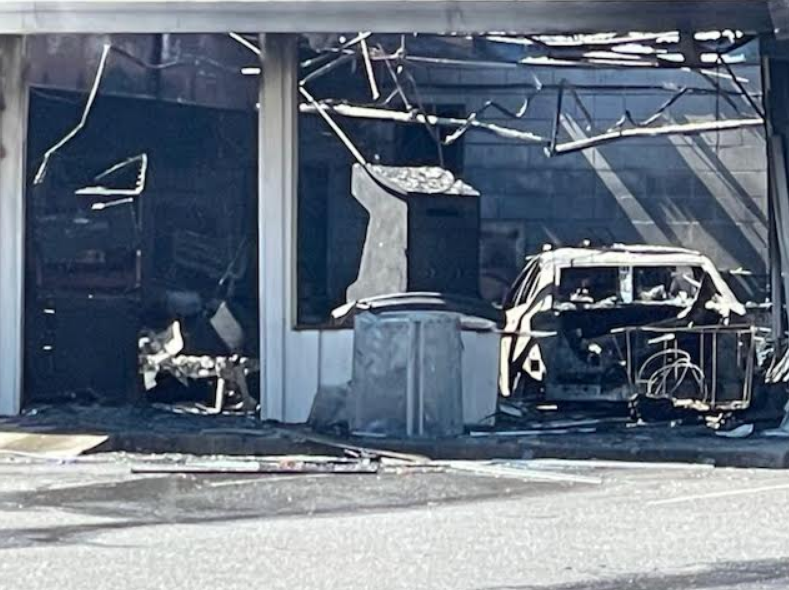 One person died after a car crashed into a Statesville laundromat, sparking a fire on Thursday.
