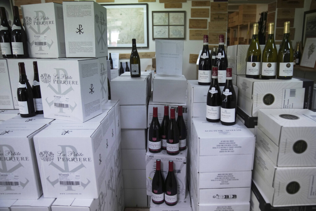 Boxes of wine are for sale at a wine dealer shop as President Donald Trump threatened a 200% tariff on European wine, Champagne and spirits if the European Union goes forward with a planned tariff on American whiskey, Thursday, March 13, 2025 in Ville d'Avray, outside Paris. (AP Photo/Christophe Ena)