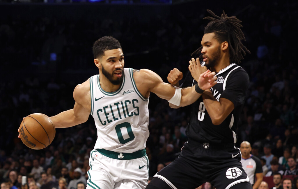 Boston Celtics forward Jayson Tatum (0) drives to the basket against Brooklyn Nets forward Ziaire Williams (8) during the first half of an NBA basketball game, Saturday, March 15, 2025, in New York. (AP Photo/Noah K. Murray)