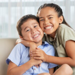 Asian Girl Hugging Brother