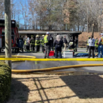 One person died after a car crashed into a Statesville laundromat, sparking a fire on Thursday.