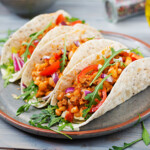 Mexican Tacos With Beef, Beans In Tomato Sauce And Salsa