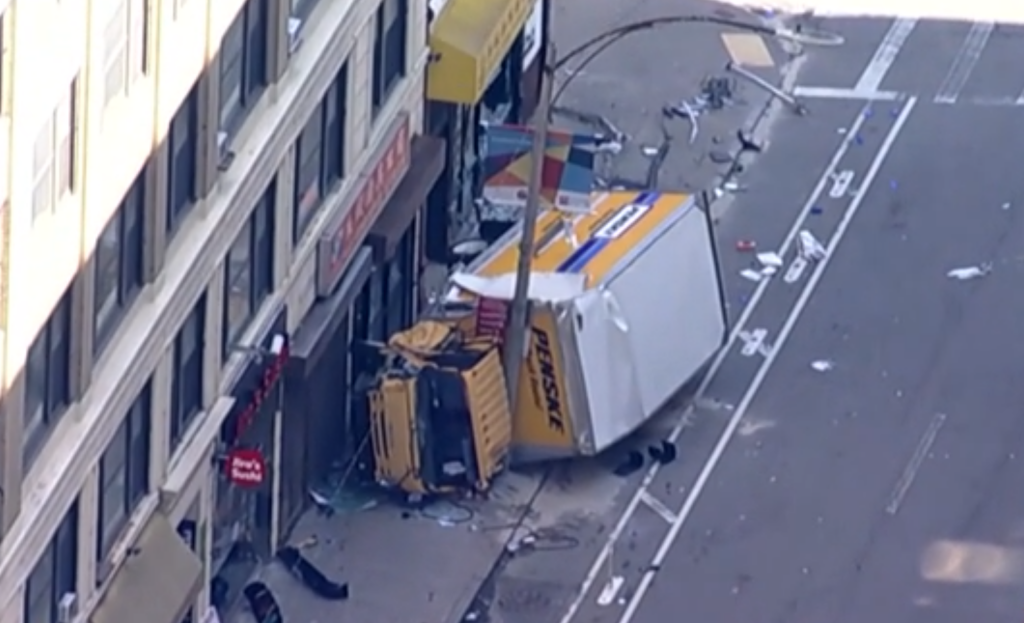 Police say a box truck crashed into a building in Boston's Chinatown neighborhood and then hit several people,