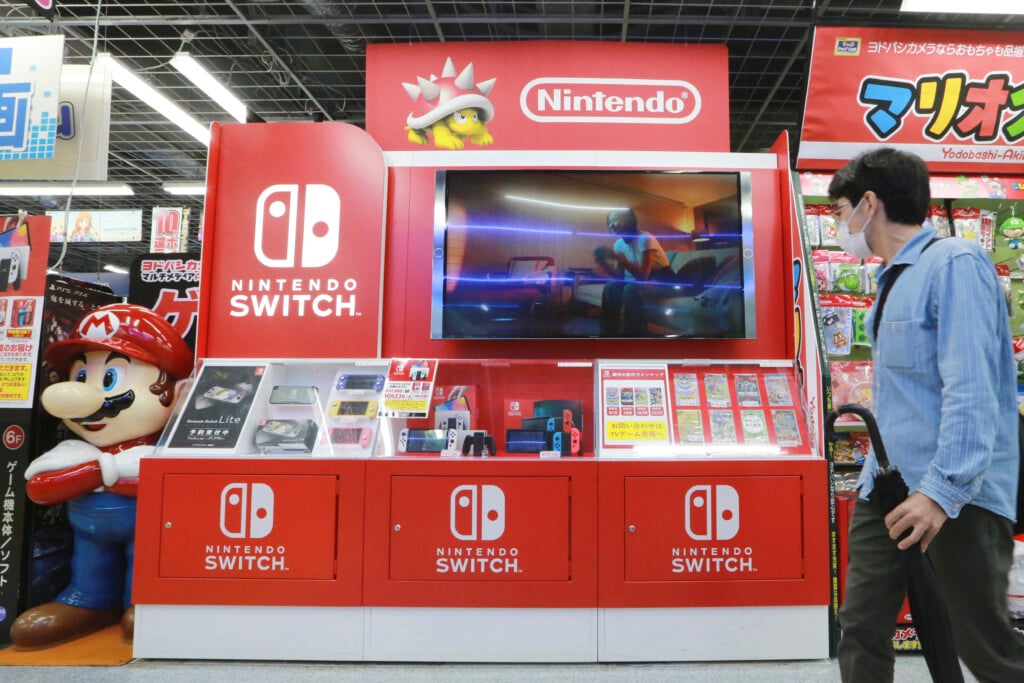 A man walks by a Nintendo Switch display at an electronics retail chain store in Tokyo, on Oct. 13, 2021. (AP Photo/Koji Sasahara, File)