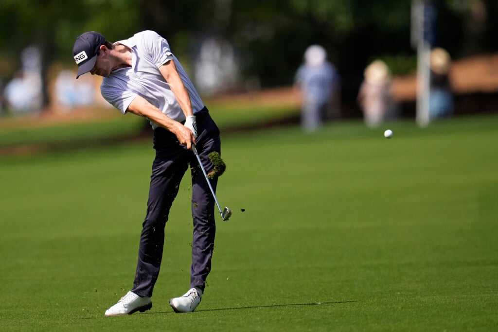 Alex Smalley hits from the fairway on the second hole during the first round of the PGA Championship golf tournament at the Quail Hollow Club, Thursday, May 15, 2025. (AP Photo/George Walker IV)