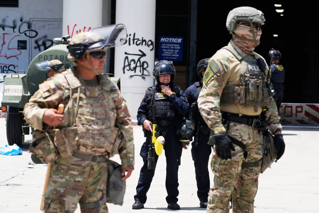 National Guard and DHS police stand guard outside the Metropolitan Detention Center, Wednesday, June 11, 2025, in Los Angeles. (AP Photo/Damian Dovarganes)