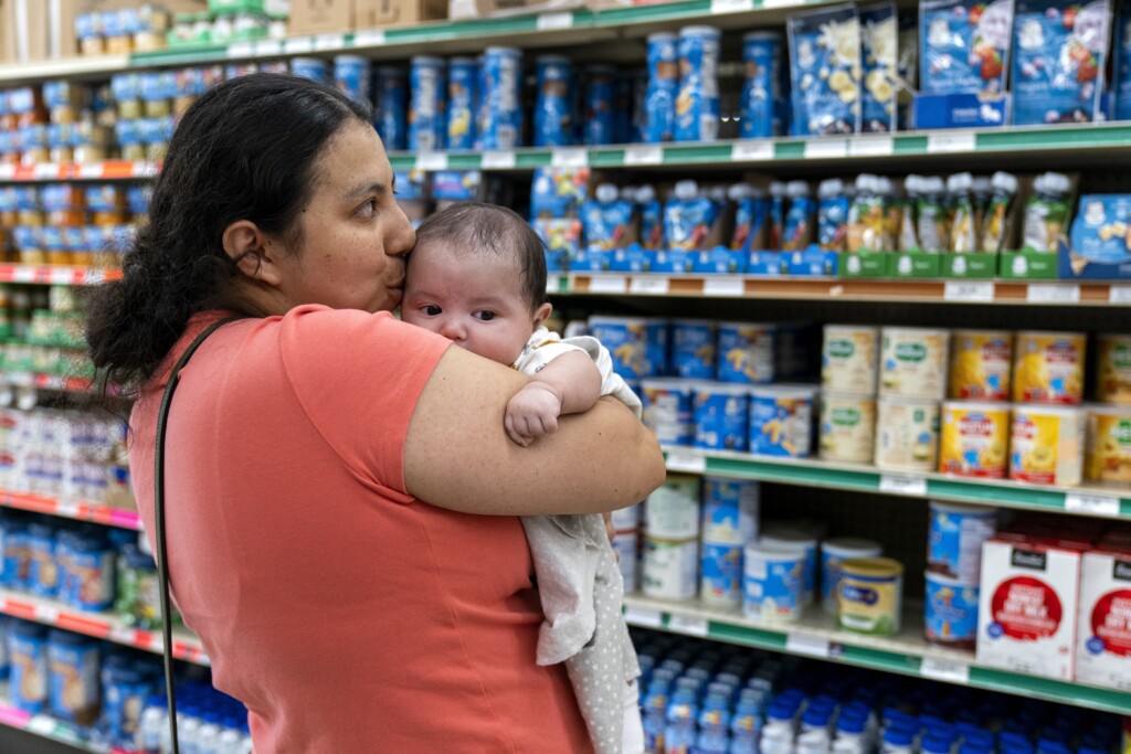 Yury Navas, 29, of Laurel, Md., kisses her two-month-old baby Jose Ismael Gálvez, at Superbest International Market in Laurel, Md., May 23, 2022, while looking for formula. (AP Photo/Jacquelyn Martin, file)