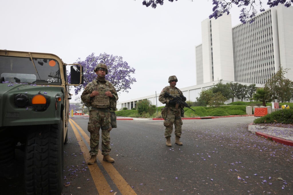 Members of the National Guard stand outside the Wilshire Federal building on Thursday, June 12, 2025. (AP Photo/Etienne Laurent)