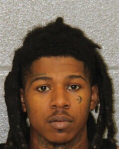 Damien Evans is charged with possession of firearm by felon and possession of stolen firearm following a mass shooting in Uptown.