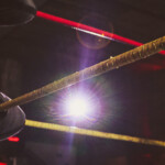 Ropes Of A Wrestling Ring Highlighted By Spotlight