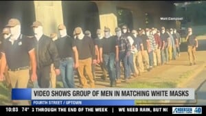 Men Walking Near Uptown In Masks