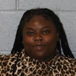 Zaniya White Financial Transaction Card Fraud Driving While License Revoked