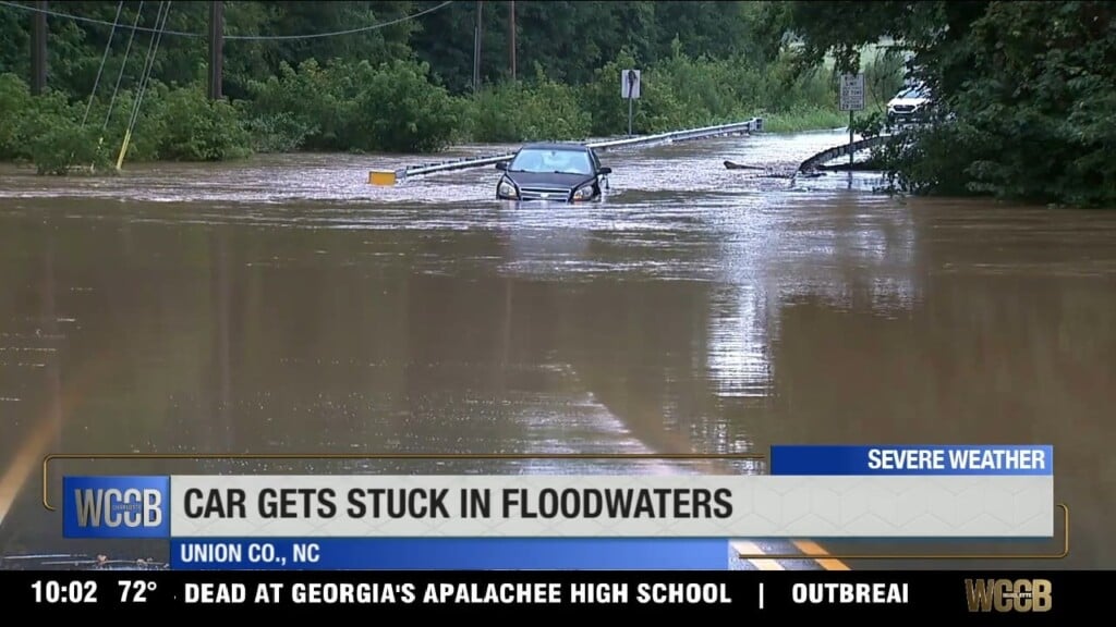 Car Gets Stuck In Floodwaters