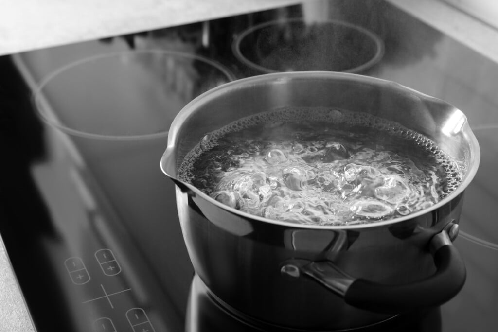 Pot With Boiling Water On Electric Stove, Space For Text