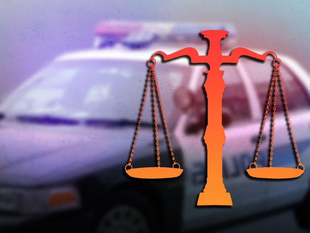 scales of justice and police car